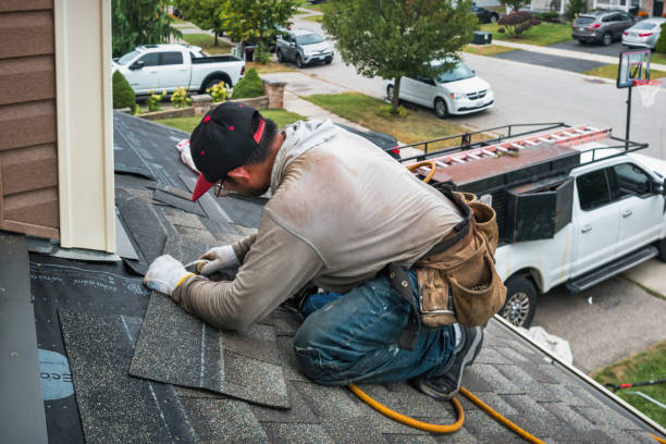 Professional Storm Damage Roof Repair technician working in Hawk Run, PA